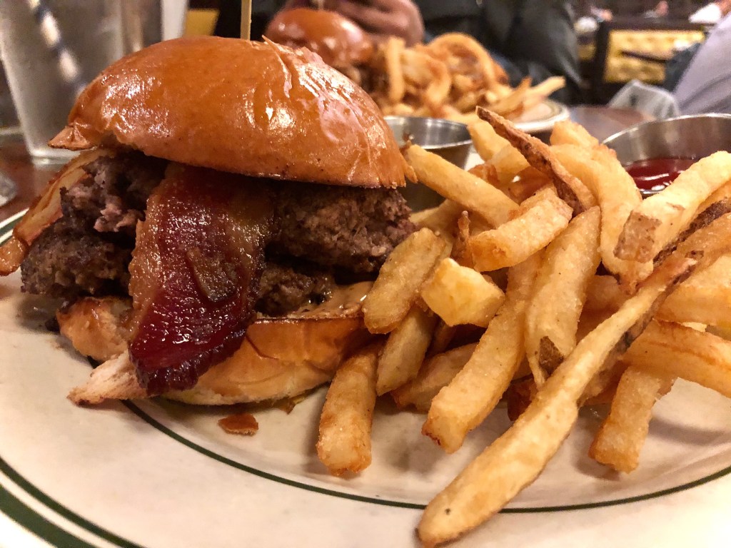 Peanut Butter Bacon Burger with a side of fries, tomato jam, and ketchup at Ted’s Bulletin