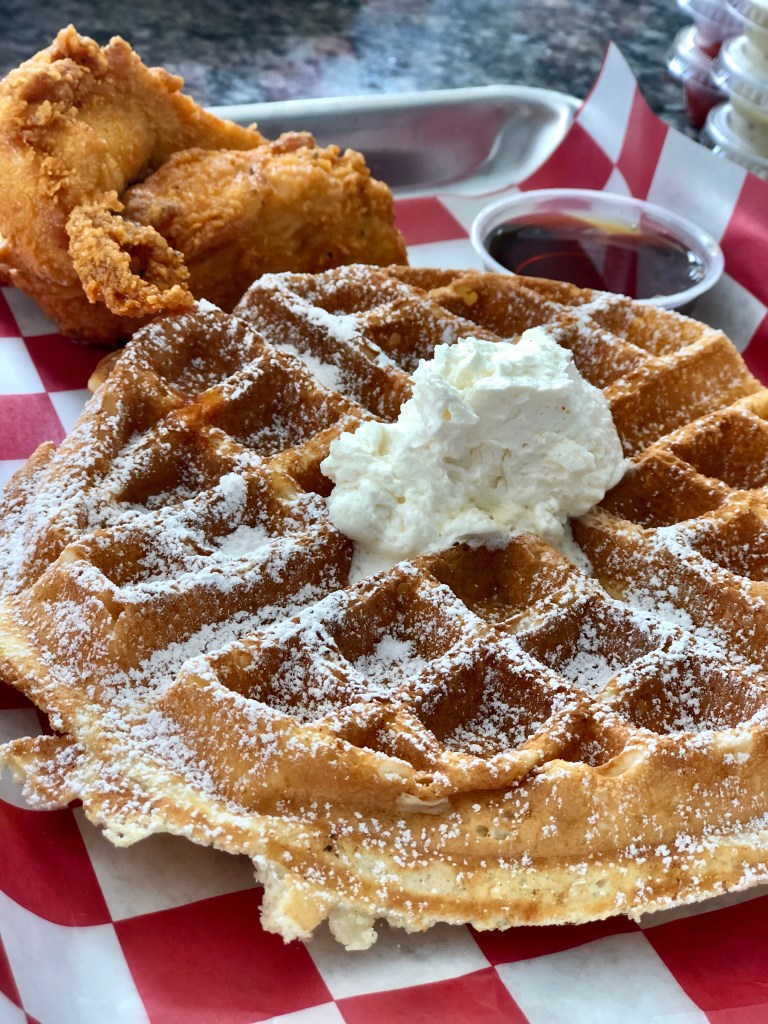 A plate of Roaming Rooster’s Chicken and Waffle. Roaming Rooster is a restaurant with multiple locations in the Washington, D.C. Metro Area.