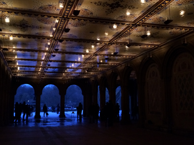 A Central Park walking tunnel (called Bethesda Terrace) with people standing inside 