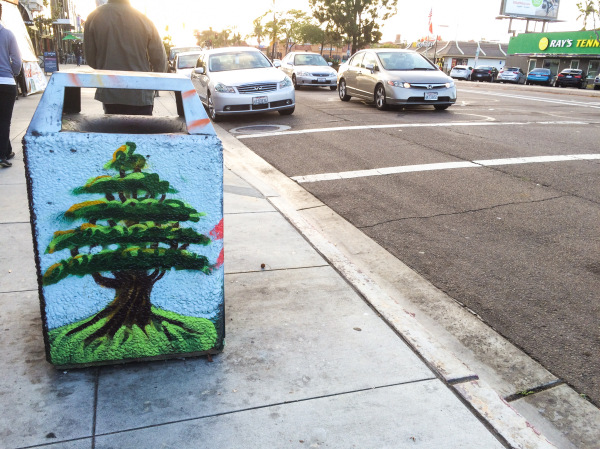 A trash can with a tree painted on it in San Diego, California