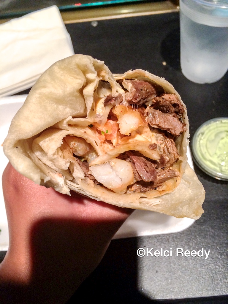 Inside of a Surf n’ Turf burrito from Lucha Libre Taco Shop, which is located in San Diego, California.