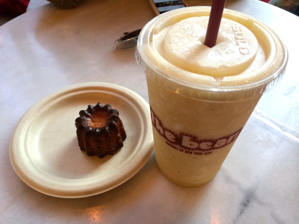 A canele cake and a milkshake at a cafe