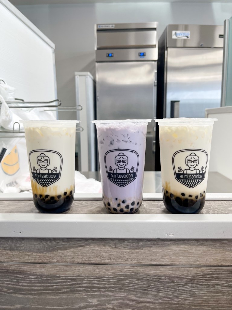 Two cereal milk teas and one taro milk tea from AunTea Boba in Lanham, Maryland