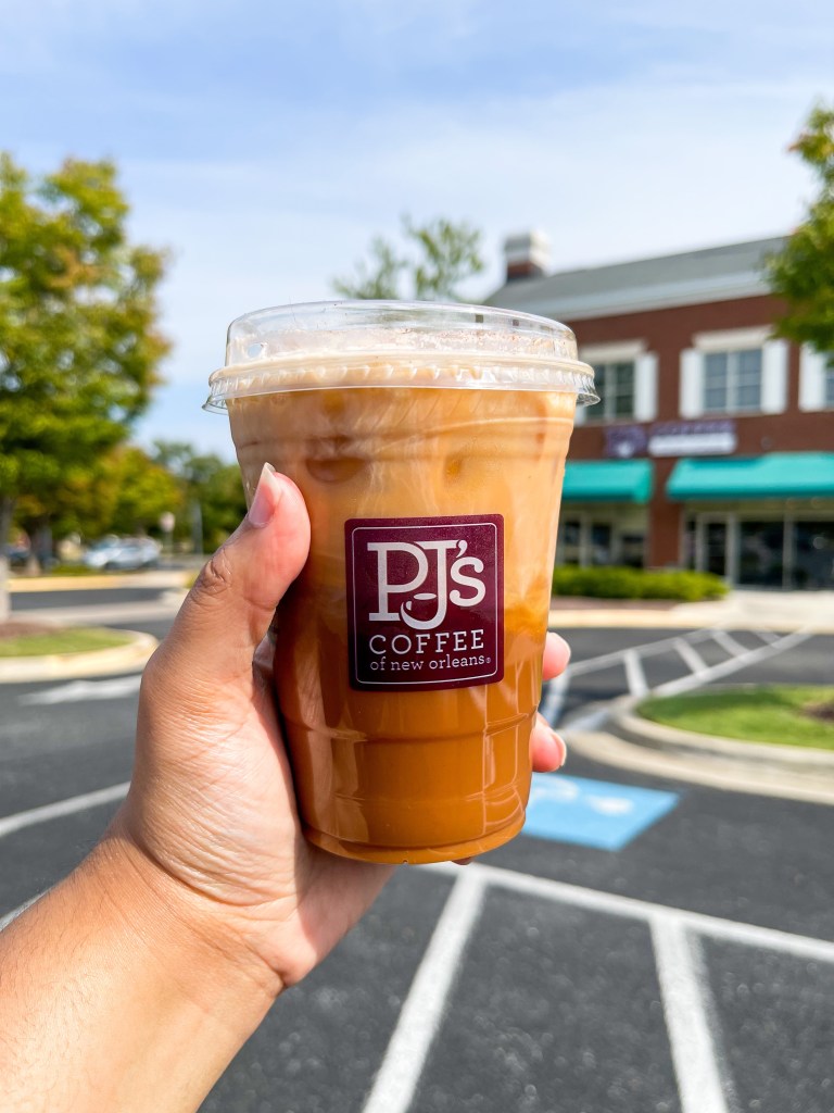 A hand holding a cold brew coffee from PJ’s Coffee in Bowie, Maryland