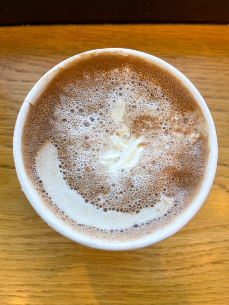 A hot chocolate drink called Hazelnutcracker Cocoa from Commonwealth Joe Coffee Roasters. Commonwealth Joe Coffee Roasters is a coffee shop located in Arlington, Virginia.