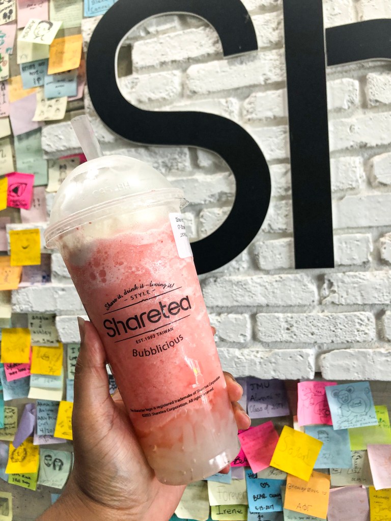 A hand holding an ice blended drink from Sharetea, a bubble tea shop in Fairfax, Virginia.