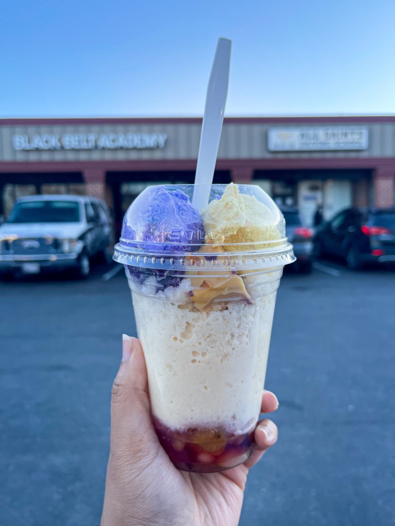 A hand holding a Filipino dessert called halo halo. This dessert is from Manila Mart, which is a Filipino shop located in Beltsville, Maryland.