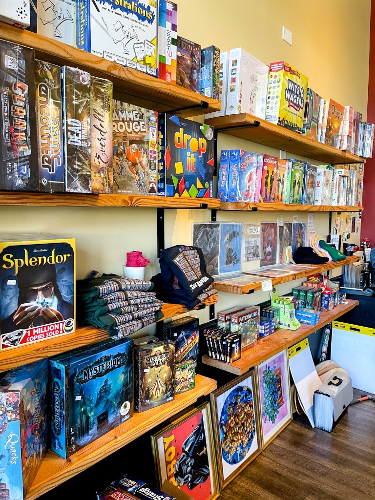 The interior of the Board and Brew, a cafe located in College Park, Maryland. Pictured is one of their walls filled with shelves of board games