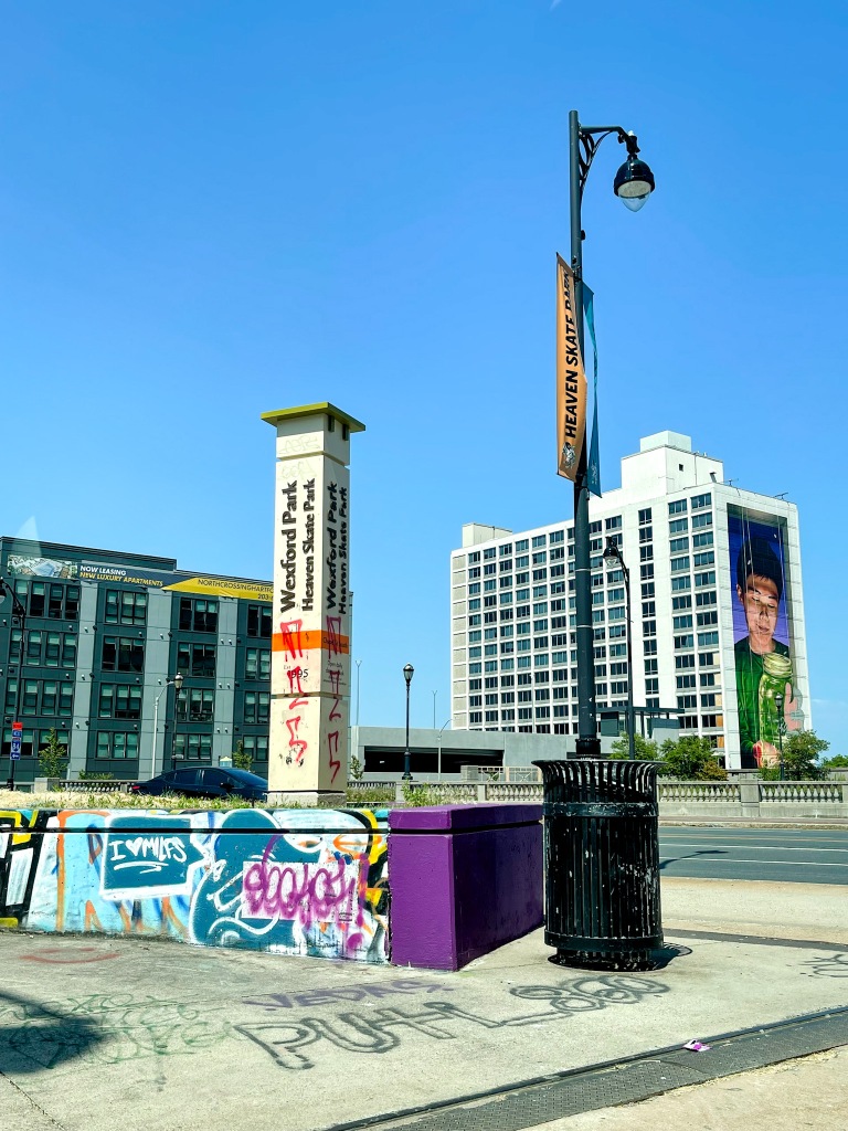 A city street corner with graffiti