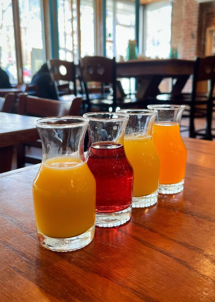 small glasses on juice on a table