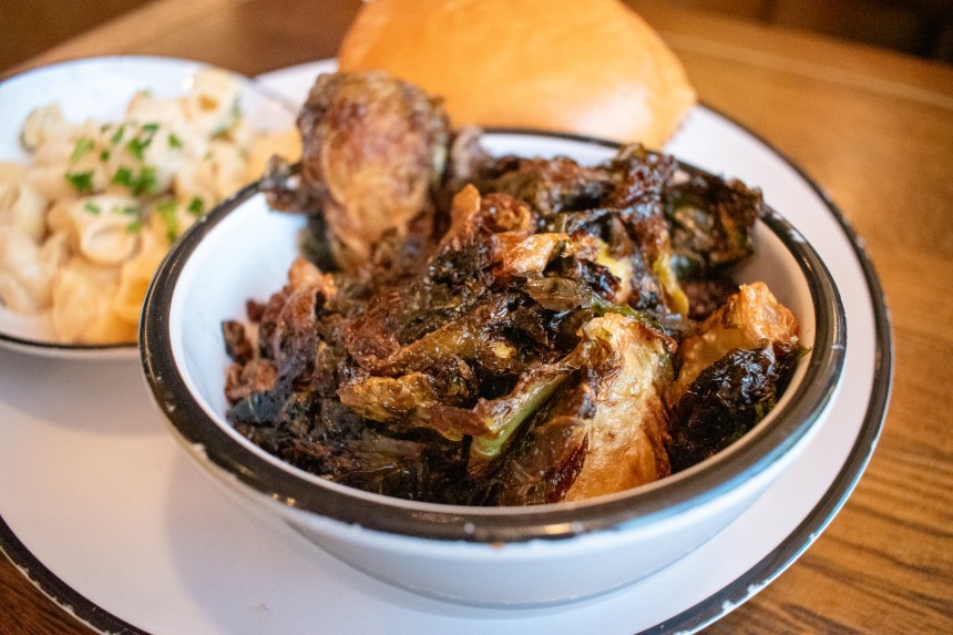Brussels sprouts in a bowl on top of a plate