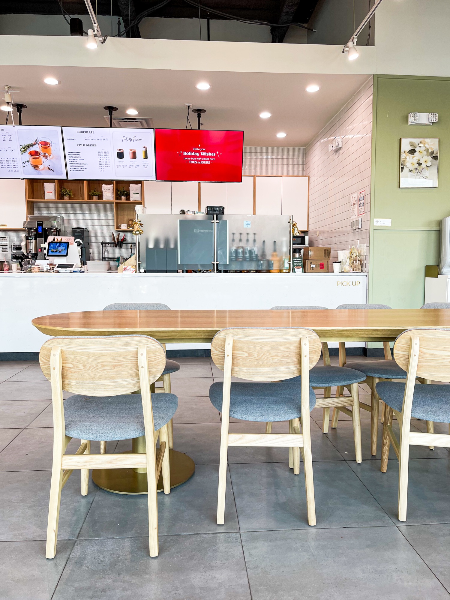 A table with chairs near the counter at Tous les Jours in Columbia, MD